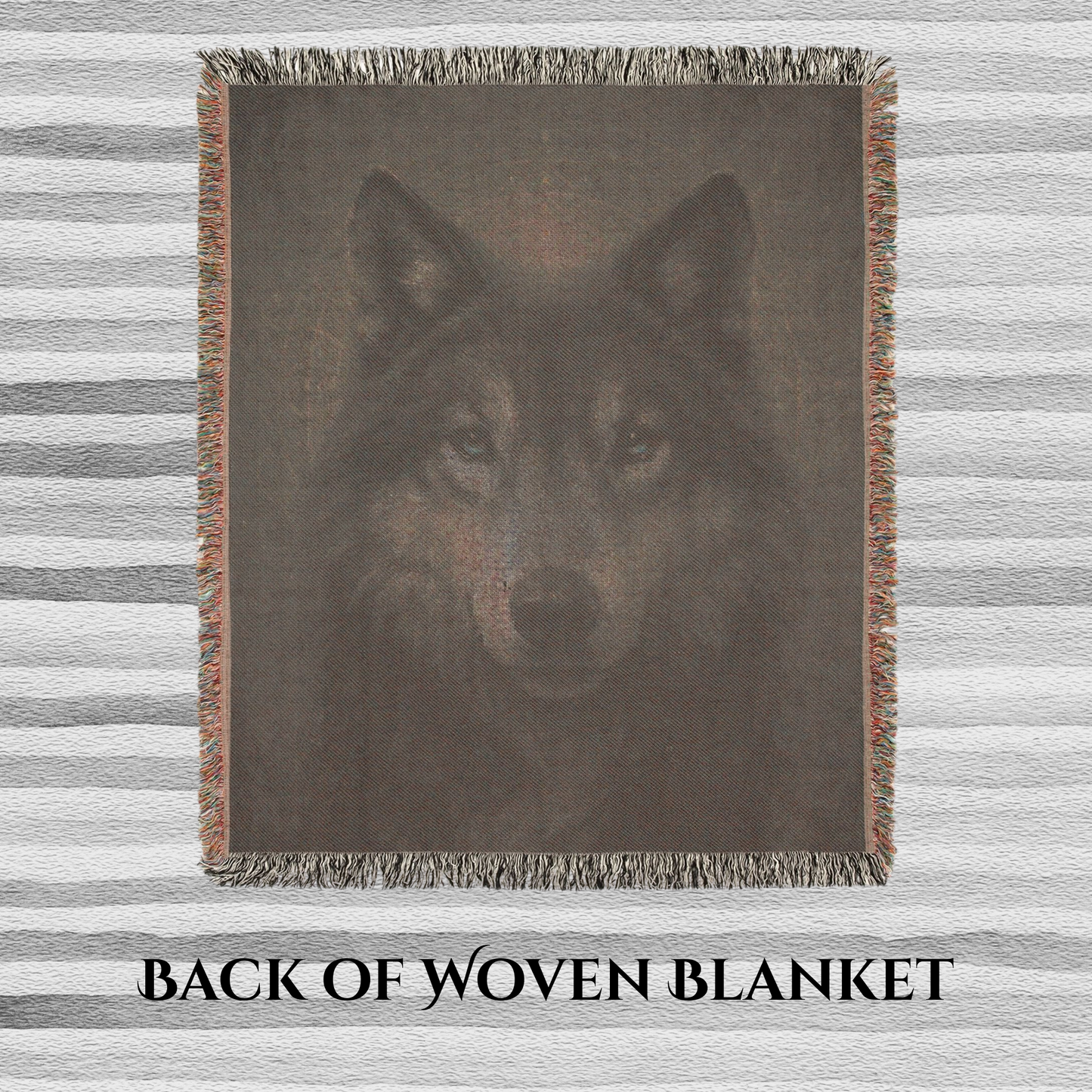 Back view of woven blanket with a wolf design on a striped background