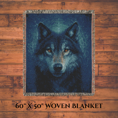 Woven blanket with a wolf design on a wooden surface