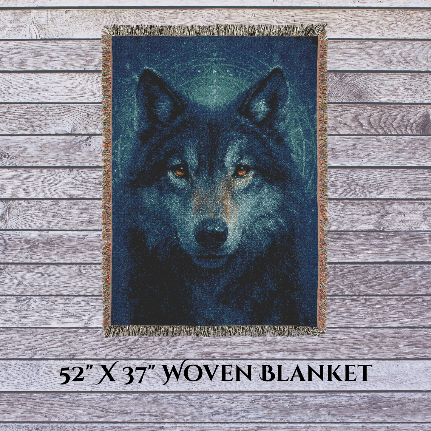 Woven blanket with a wolf design on a wooden surface