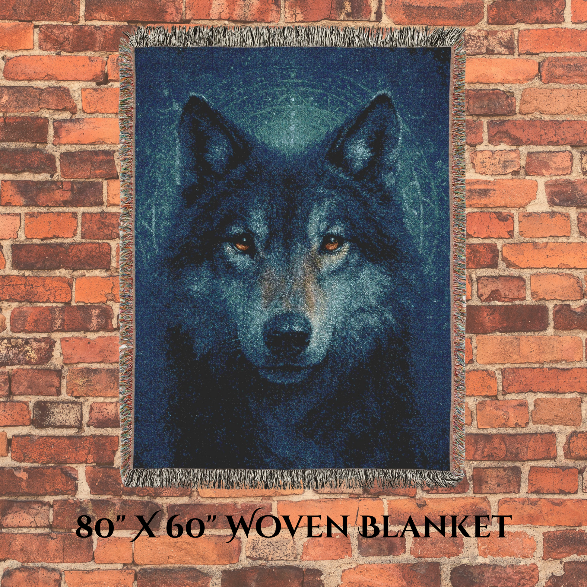 Woven blanket with a wolf design on a brick wall background