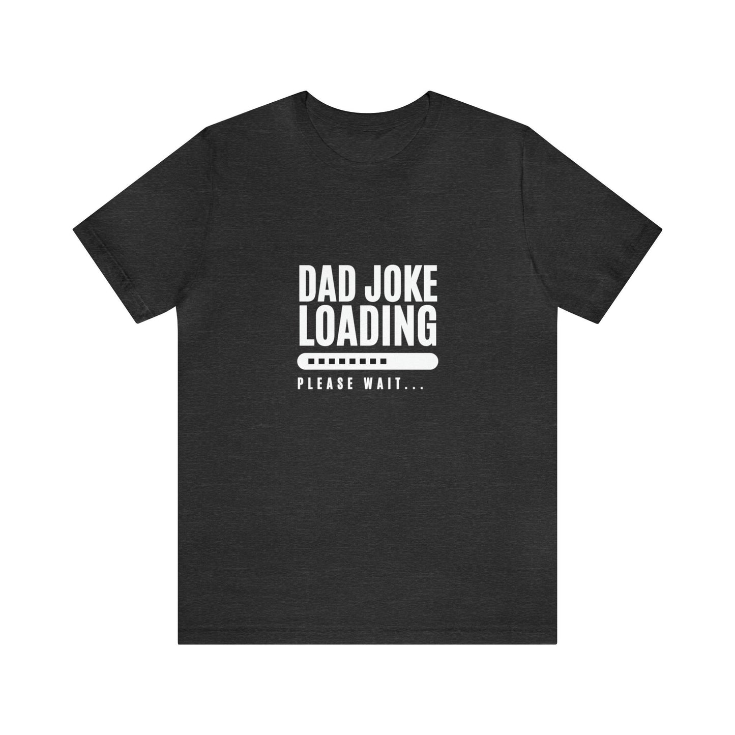 Dark heather gray unisex T-shirt featuring the humorous phrase “Dad Joke Loading, Please Wait…” in bold white letters with a progress bar graphic centered on the front.