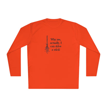 Flat lay of a orange long-sleeve Halloween shirt featuring a black graphic of a broomstick and the fun witch-themed quote &quot;Why yes, actually, I can drive a stick!&quot; — ideal for spooky season fashion, fall outfits, and Halloween party wear. Perfect novelty shirt for women who love witchy humor and festive October apparel.