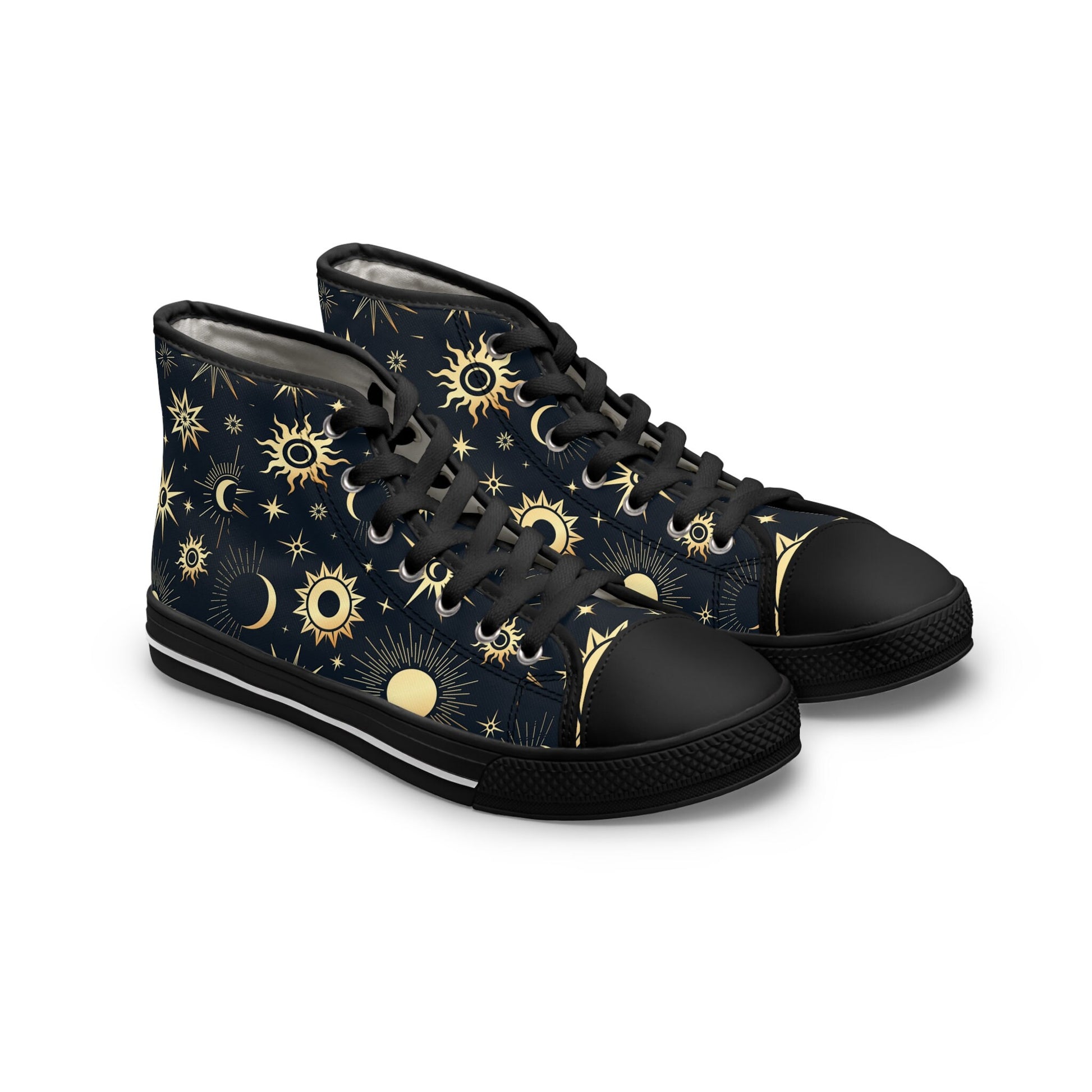 Angled view of a pair of high-top sneakers featuring a celestial pattern with golden suns, moons, and stars on a dark navy background. The shoes have black laces, black rubber toe caps, and black soles with a white stripe detail. The design combines mystical cosmic elements with a bold, modern streetwear style.