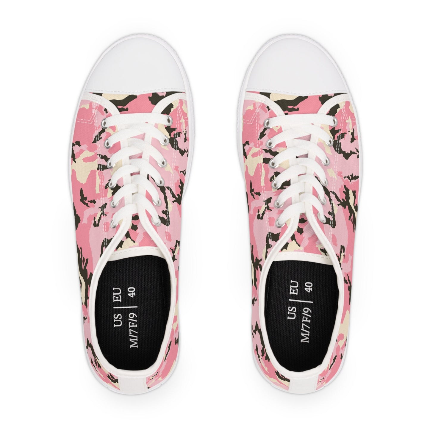 Top view of pink camouflage low-top canvas sneakers with white laces, white rubber toe caps, and black insoles labeled with US and EU sizes—stylish and comfortable for everyday wear.