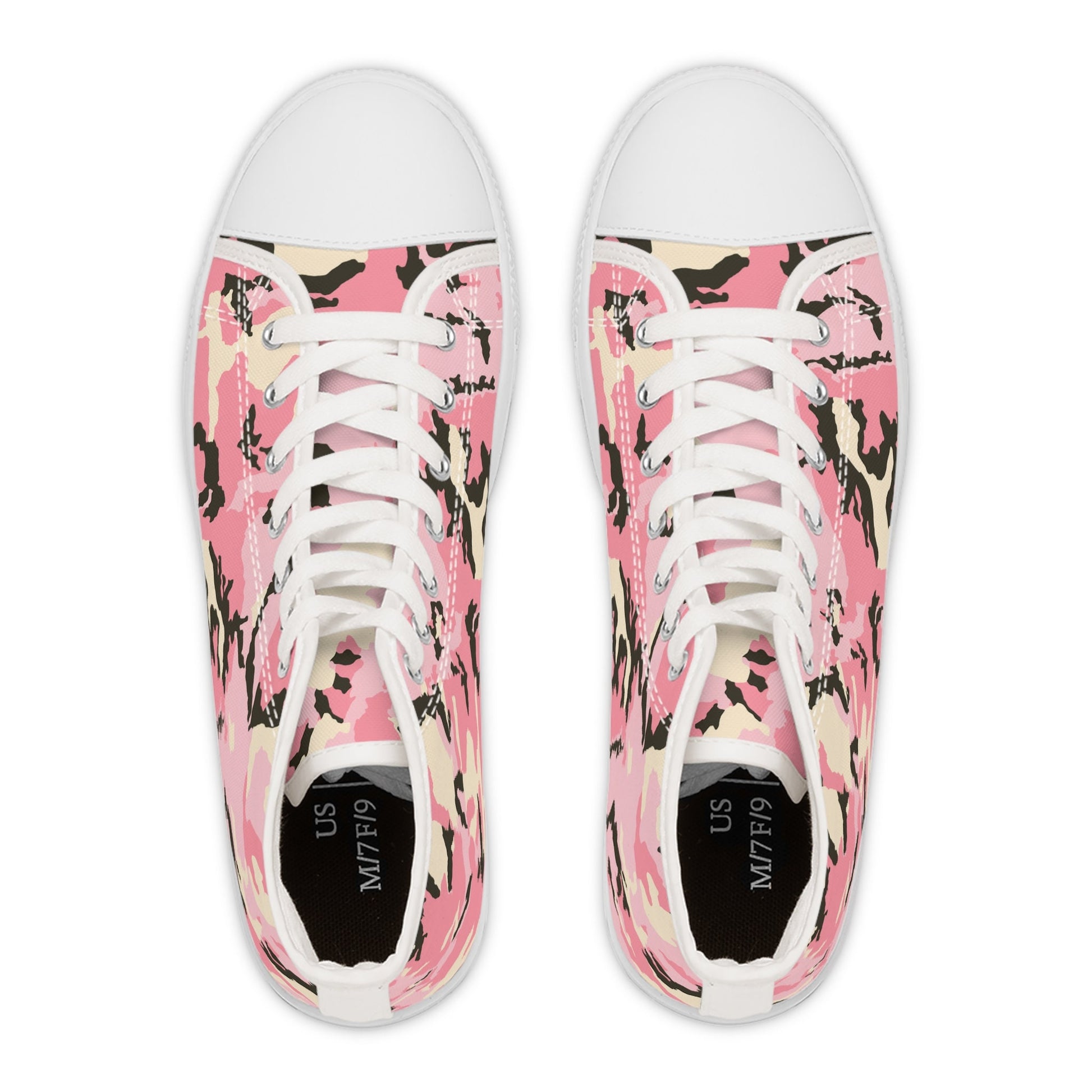 Top-down view of a pair of high-top sneakers featuring a bold pink camouflage pattern with black, beige, and white accents. The shoes have white rubber toe caps, white laces, and black insoles labeled with the size &quot;US M7/F9.&quot; The design is symmetrical and eye-catching, blending urban streetwear with a playful, feminine twist.