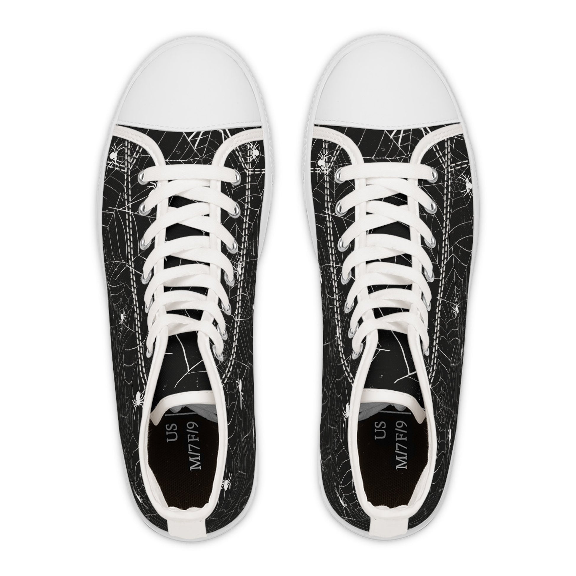 Top-down view of a pair of black high-top sneakers with white soles, toe caps, and laces. The shoes feature a white spiderweb and spider pattern on the canvas. Inside the heel area, the sizing label shows &#39;US M7/F9&#39; on each shoe.