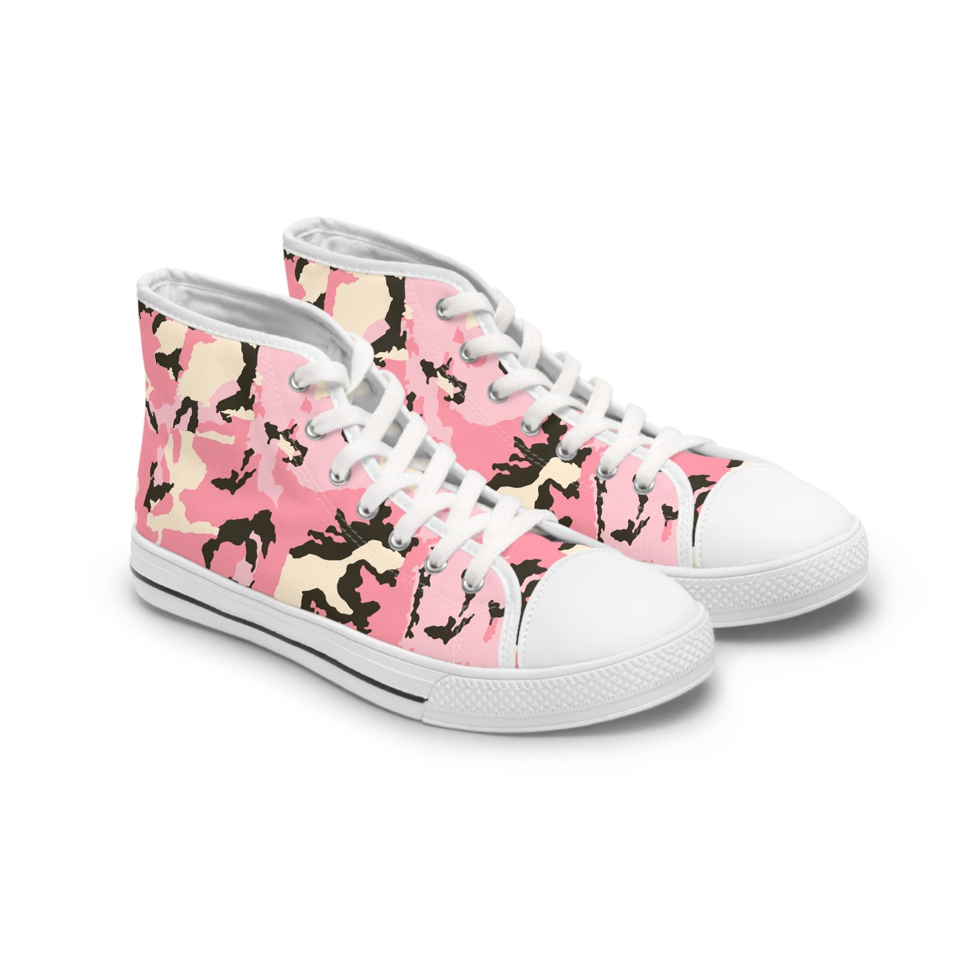 Angled view of a pair of high-top canvas sneakers featuring a vibrant pink camouflage pattern with black, beige, and light pink accents. The shoes have white rubber soles, white laces, and white toe caps, with a classic silhouette and durable stitching. The design is bold and stylish, blending urban edge with playful color.