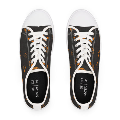 Top view of Halloween-themed canvas sneakers featuring orange jack-o&#39;-lantern face pattern on a black background with white laces and rubber toe caps – unisex US size 9 / EU 40 low-top shoes, perfect for spooky season outfits, Halloween events, and autumn fashion.