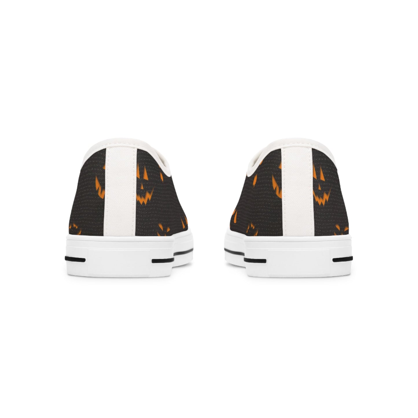 Back view of Halloween low-top canvas sneakers featuring a spooky orange jack-o&#39;-lantern face print on black fabric with white heel accents and white rubber soles – festive fall shoes perfect for Halloween outfits, trick-or-treat events, and spooky season fashion.