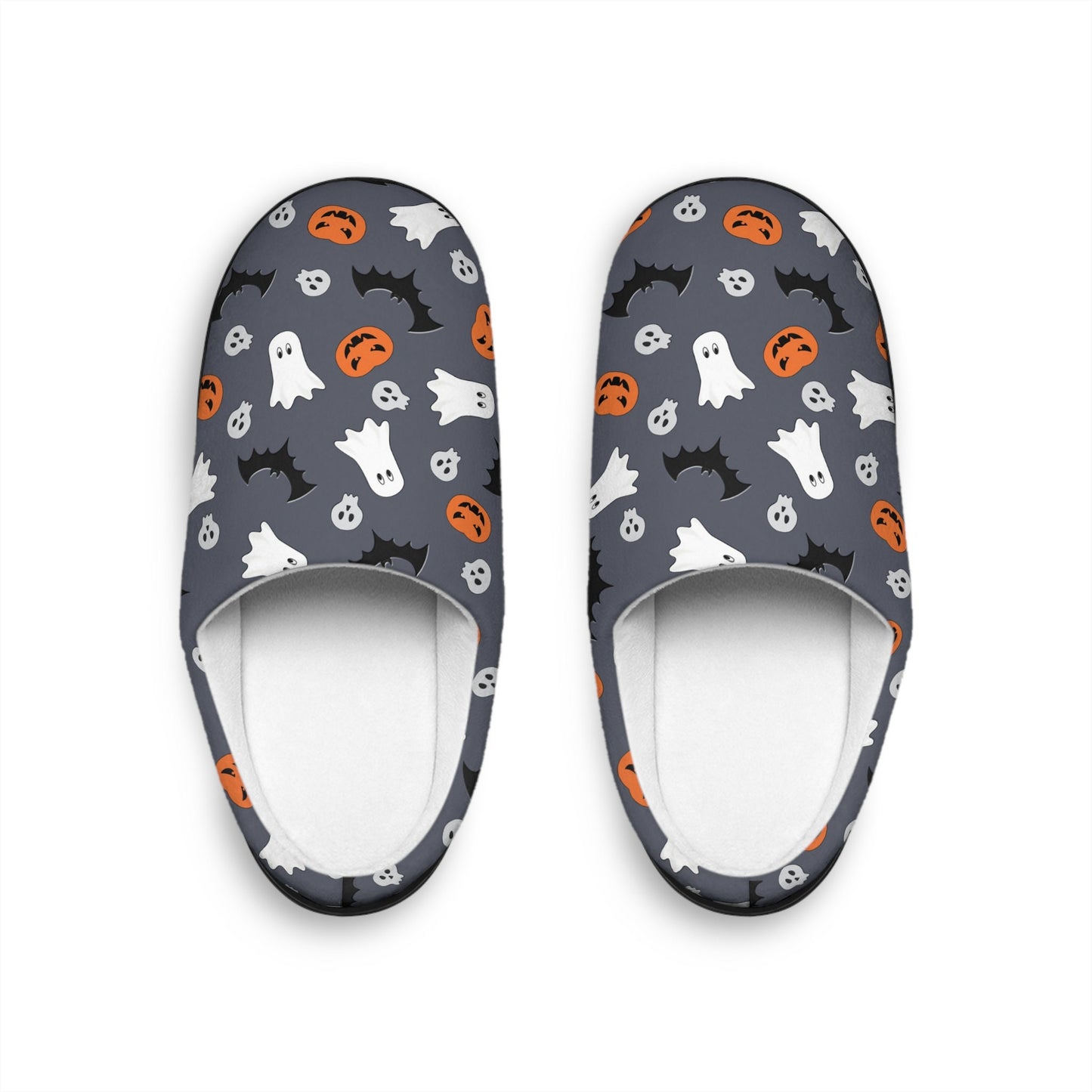 Top-down view of a pair of Halloween-themed slippers on a white background. The slippers feature a dark gray base with a fun pattern of white ghosts, black bats, orange jack-o&#39;-lanterns, and small skulls. The interior lining is white, creating a cozy and festive look.
