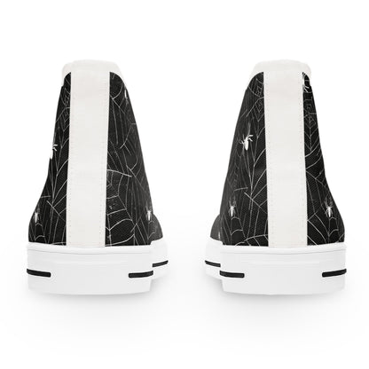 Rear view of a pair of black high-top sneakers with a white spiderweb and spider pattern. The shoes feature a white vertical stripe along the back heel and have thick white rubber soles with black accents.