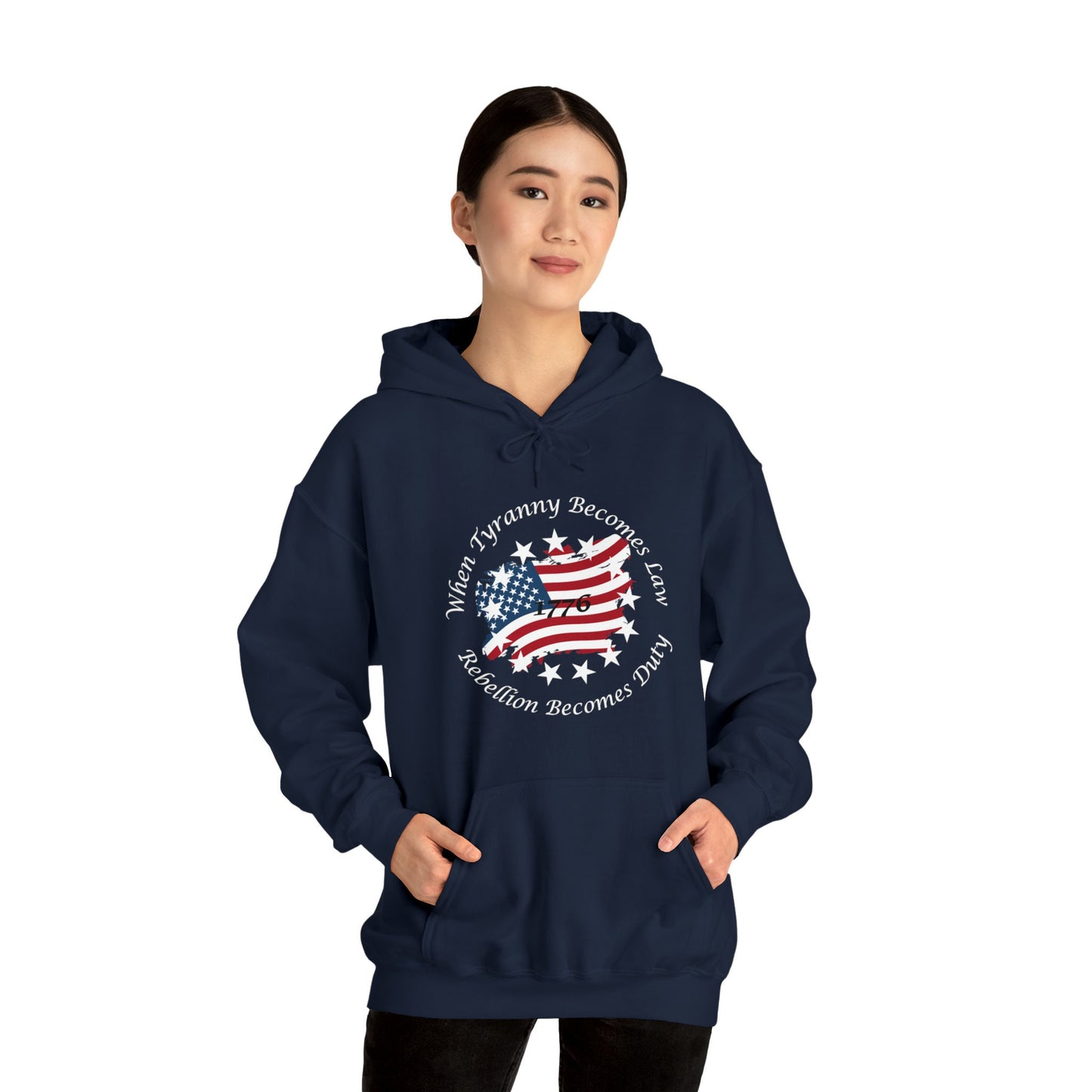 Navy Blue unisex hoodie with distressed American flag and “When Tyranny Becomes Law, Rebellion Becomes Duty” quote, modeled by woman on white background. 1776 patriotic pullover sweatshirt for men and women, bold conservative statement apparel, pro-freedom American hoodie. Ideal for political expression, USA pride, or patriotic gift ideas.