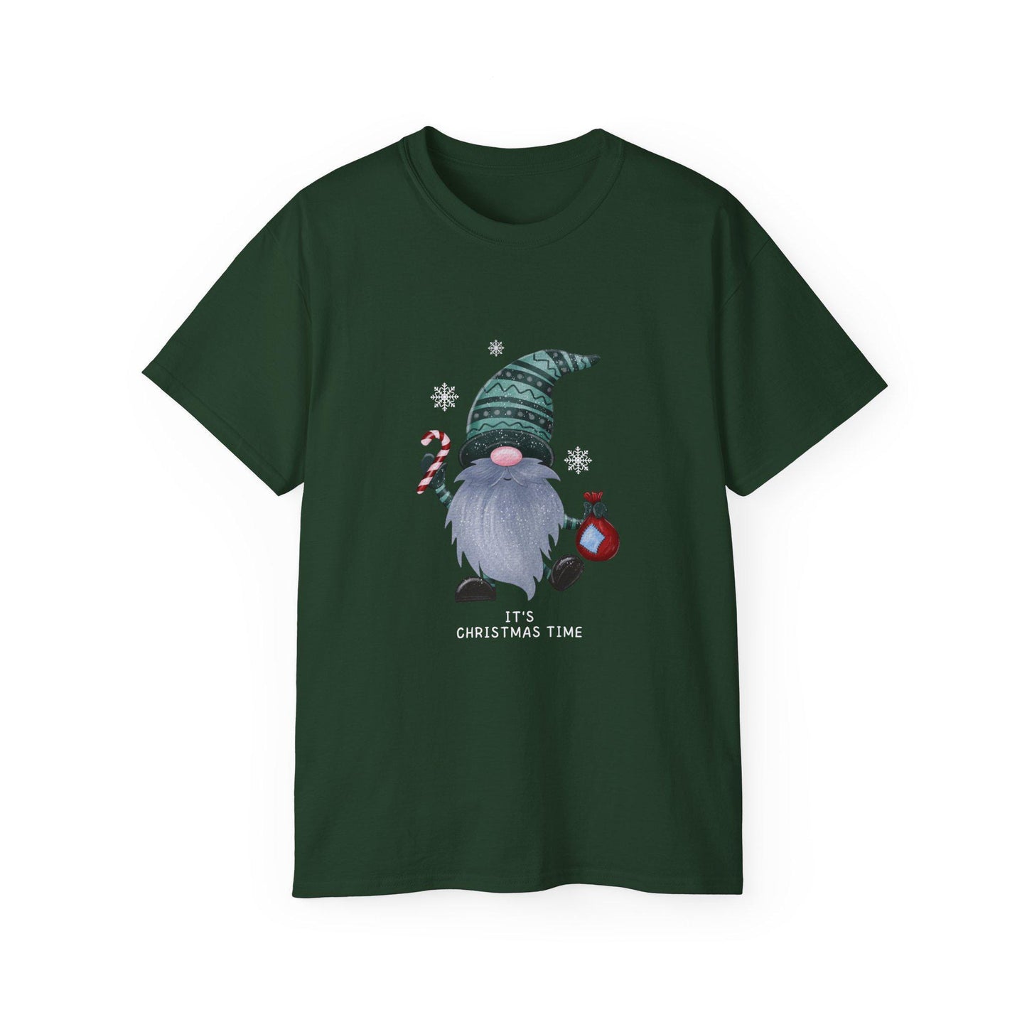A dark green unisex T-shirt is displayed against a white background, featuring a festive Christmas gnome graphic. The gnome has a long gray beard, a pink nose, and is wearing a patterned green hat. He holds a candy cane in one hand and a red ornament in the other, surrounded by white snowflakes. Below the illustration, the phrase &quot;It&#39;s Christmas Time&quot; is printed in white text. The shirt has a classic crew neck and short sleeves.