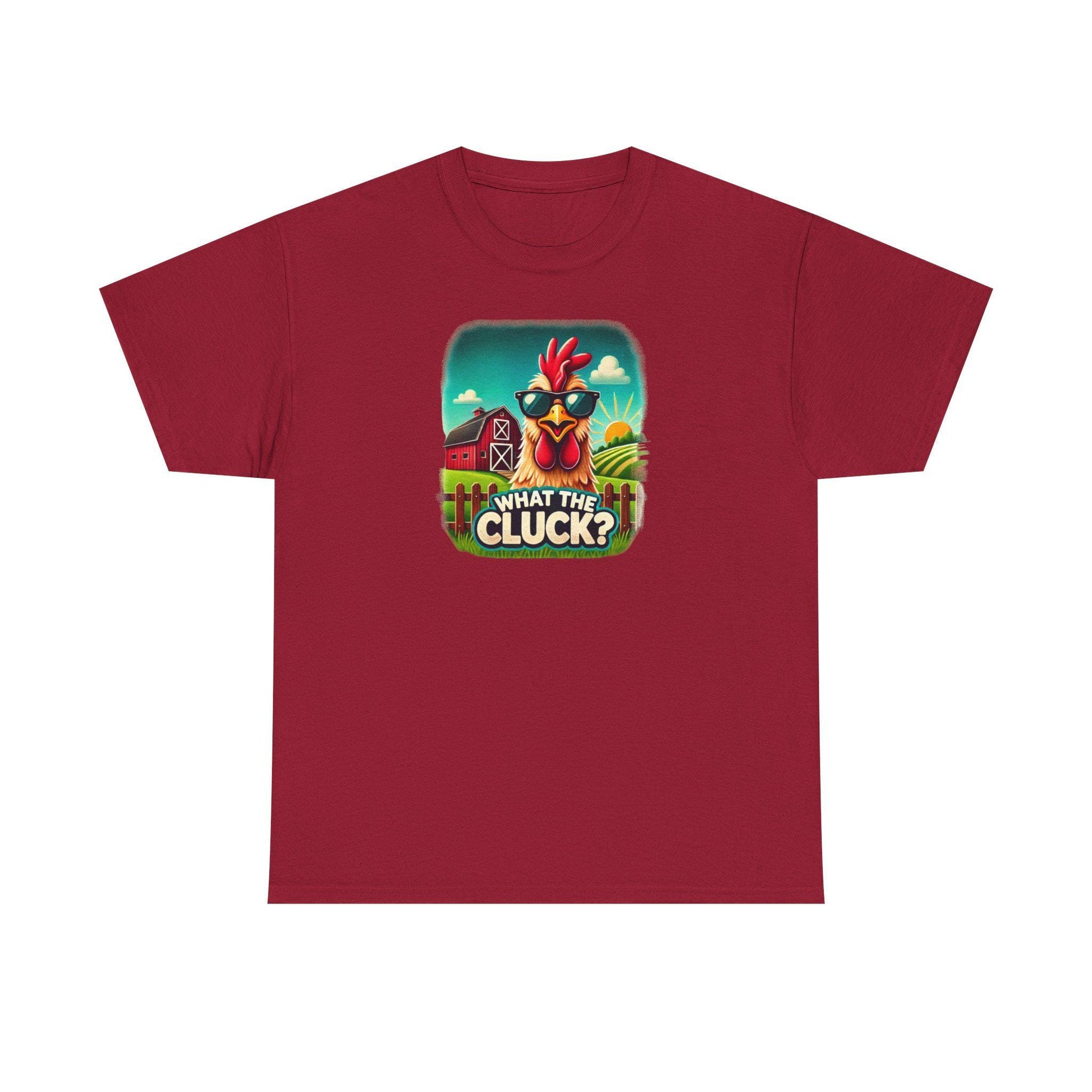 Red unisex t-shirt with a colorful cartoon graphic of a chicken wearing sunglasses, standing in front of a red barn and sunny farm scene, featuring the playful phrase &quot;What the Cluck?&quot; printed below.