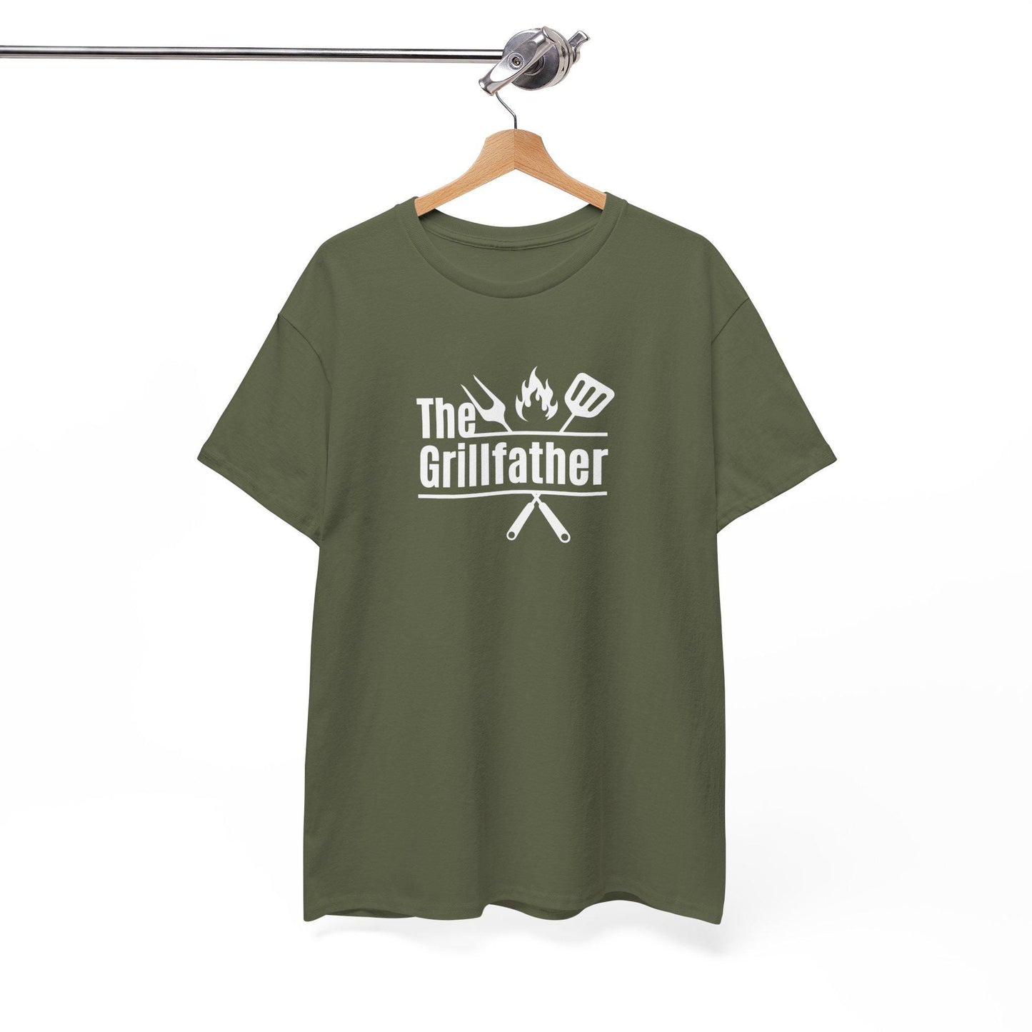 Olive green T-shirt on a wooden hanger with the phrase “The Grillfather” in white text, featuring grilling icons including a fork, flame, and spatula above crossed utensils, displayed against a plain background.