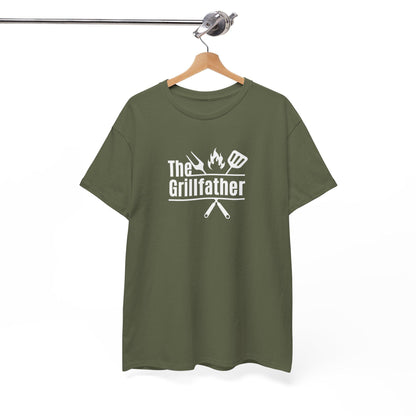 Olive green T-shirt on a wooden hanger with the phrase “The Grillfather” in white text, featuring grilling icons including a fork, flame, and spatula above crossed utensils, displayed against a plain background.