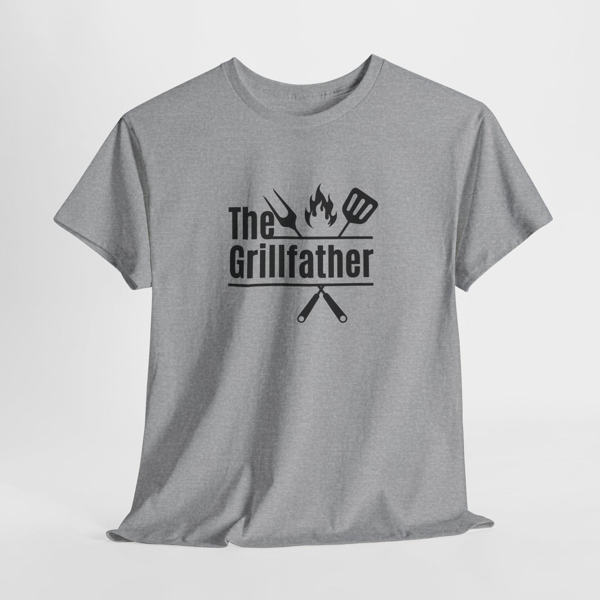 Gray T-shirt displayed against a plain background with the phrase “The Grillfather” in bold black text, featuring grilling icons including a fork, flame, and spatula above crossed utensils.