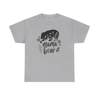 Beige t-shirt laid flat on a white background, featuring a bold black &#39;Mama Bear&#39; graphic. The design includes a silhouette of a bear filled with floral and butterfly elements, with the words &#39;mama bear&#39; written below and surrounded by decorative leaves and flowers.