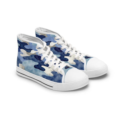 A pair of stylish high-top sneakers featuring a blue camouflage pattern with hints of white and silver accents. The shoes have white rubber soles, white toe caps, and white laces, creating a clean and modern contrast against the bold camo design. The sneakers are displayed on a plain white background.