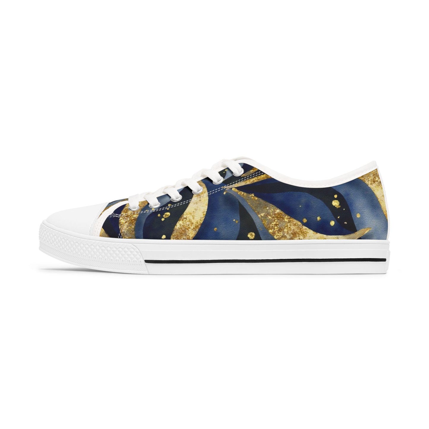 A side view of a low-top canvas sneaker featuring a celestial-inspired design with deep blue and gold swirling patterns resembling stars and comets. The shoe has a white sole, white toe cap, white laces, and a thin black stripe above the sole. The background is plain white, emphasizing the shoe’s artistic and vibrant design.