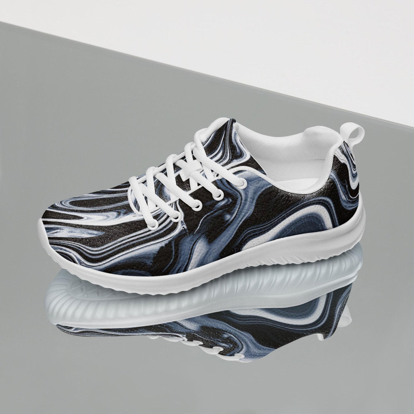 Stylish women&#39;s athletic sneaker featuring a black, white, and gray marble swirl design with white laces and a thick white sole. Lightweight and breathable with a modern aesthetic, perfect for gym workouts, casual wear, or everyday walking shoes with a bold artistic twist.