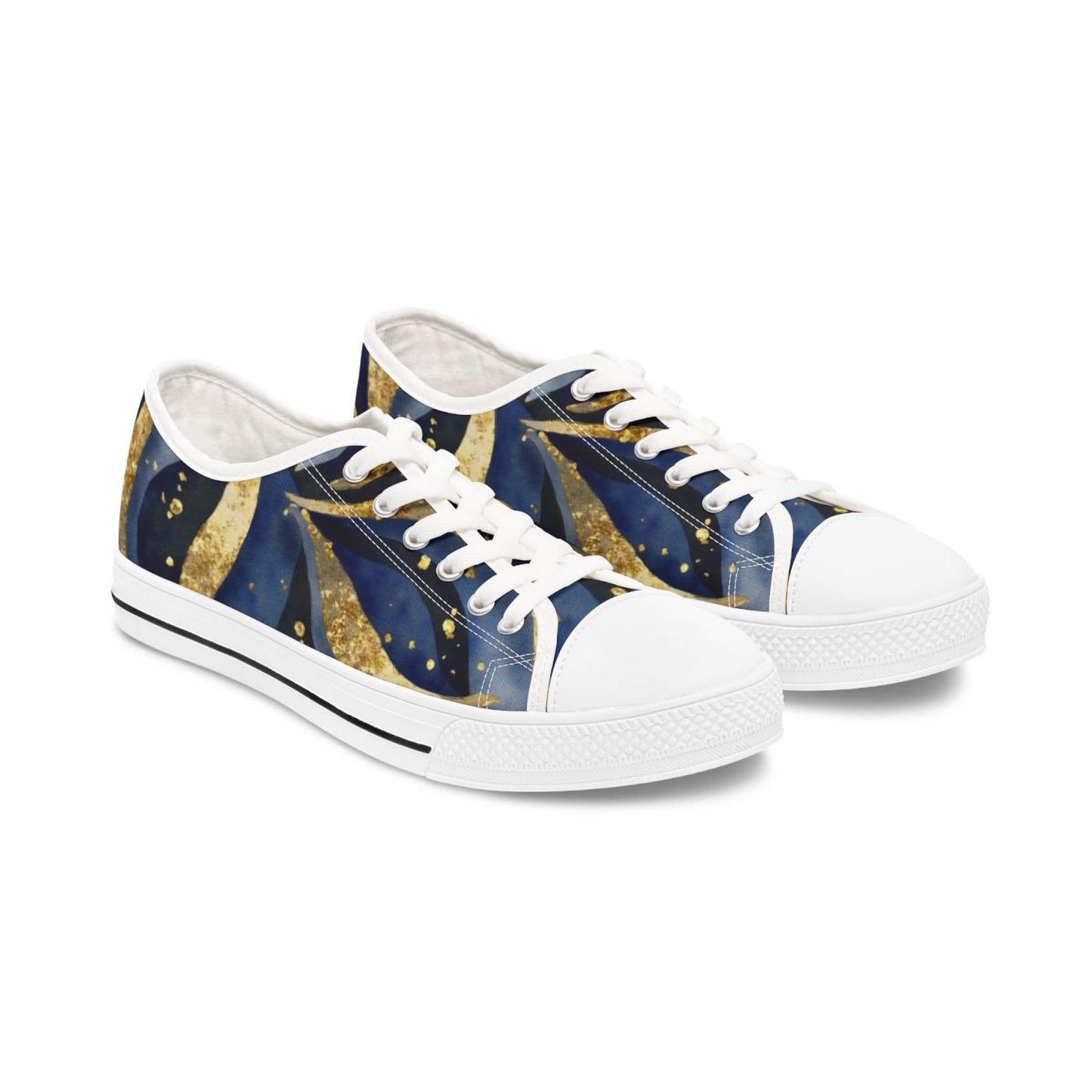 A pair of low-top canvas sneakers featuring a celestial-themed design with swirling deep blue and gold patterns, resembling stars and cosmic trails. The shoes have white rubber soles, white laces, and white toe caps, with a thin black stripe running along the midsole. The sneakers are displayed against a plain white background, highlighting their artistic and vibrant look.