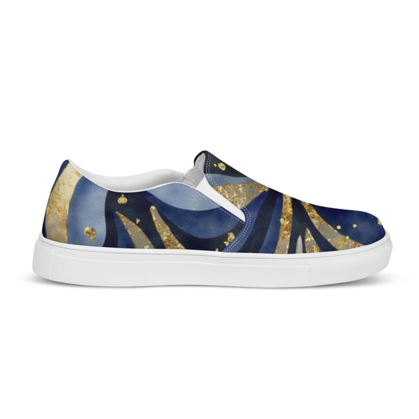 A side view of a slip-on sneaker featuring a celestial-themed design with swirling patterns in deep blue, black, and shimmering gold tones. The shoe has a sleek white sole and white inner lining, with elastic side panels for easy wear. The background is plain white, making the bold and artistic cosmic design stand out.
