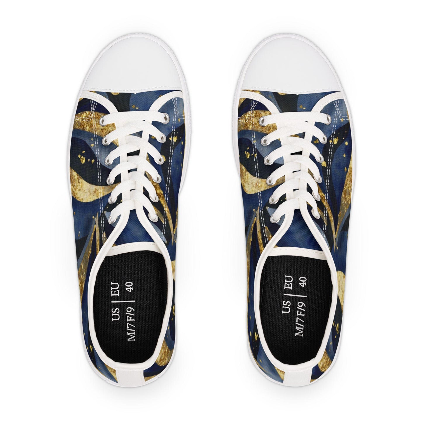 Top-down view of a pair of low-top canvas sneakers with a celestial-themed design in deep blue and gold tones, featuring swirling comet-like patterns. The shoes have white laces, white toe caps, and white soles. The insoles display size information: US M7/F9 and EU 40. The background is plain white, emphasizing the vibrant design and size markings inside the shoes.