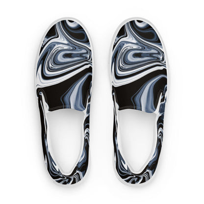 Top-down view of women&#39;s slip-on canvas shoes featuring a bold black, white, and gray marbled swirl pattern. Stylish and artistic footwear with a modern abstract design, perfect for casual everyday outfits