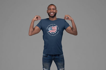 Smiling man wearing a blue graphic t-shirt featuring a distressed American flag with the quote &quot;When Tyranny Becomes Law, Rebellion Becomes Duty&quot; and the year 1776—patriotic apparel perfect for Independence Day or everyday freedom-loving style.