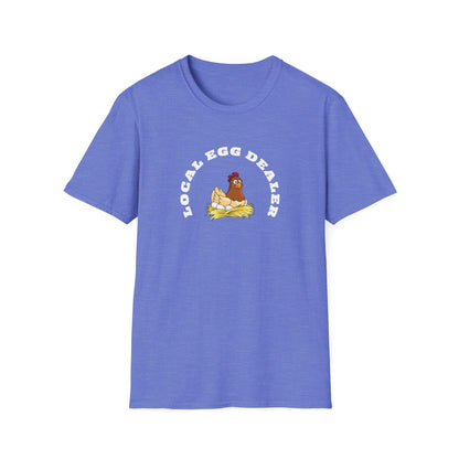 Etsy SEO Writer said:

Heather blue unisex t-shirt with a playful design featuring a cartoon hen sitting on a nest of eggs. The text “LOCAL EGG DEALER” is printed in bold white letters above the illustration in an arch shape. The shirt is laid flat on a white background, highlighting its casual fit and crew neckline.