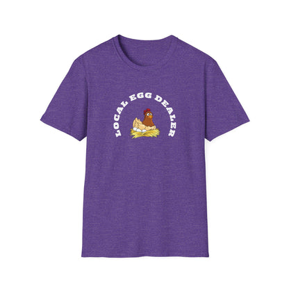 Etsy SEO Writer said:

Heather purple unisex t-shirt with a humorous graphic of a cartoon hen sitting on a nest of eggs. Above the illustration, bold white text reads “LOCAL EGG DEALER” in a curved arch. The shirt is laid flat on a white background, highlighting its soft texture, relaxed fit, and crew neck design.