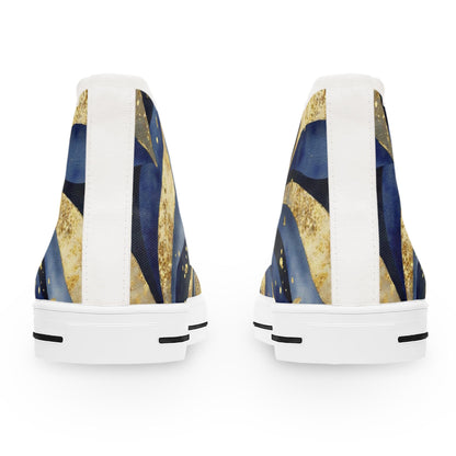 Rear view of a pair of high-top sneakers featuring an abstract design in navy blue, gold, and black with dotted accents. The shoes have white vertical heel strips, white rubber soles, and black traction detailing on the outsoles, displayed against a clean white background.