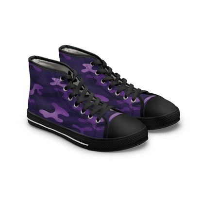 A pair of high-top canvas sneakers featuring a purple camouflage pattern. The shoes have black rubber toe caps, black soles with a white stripe, and black laces threaded through metal eyelets. The bold design combines streetwear style with a rugged, urban edge.