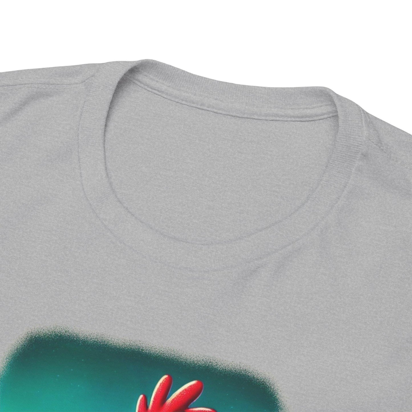 Close-up view of a light gray t-shirt collar showing the soft ribbed neckline and upper portion of a printed design featuring the red comb of a cartoon chicken against a teal background.