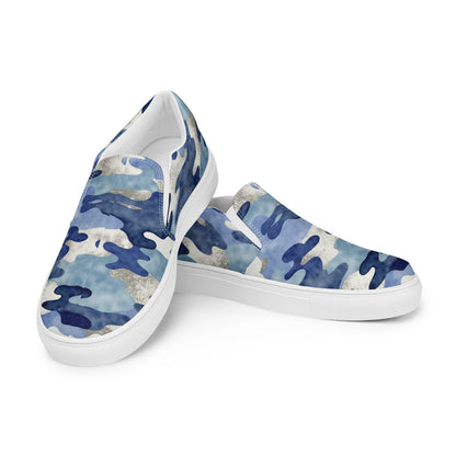 Women’s slip-on canvas sneakers with blue camo pattern and white rubber soles, lightweight casual shoes for everyday wear.