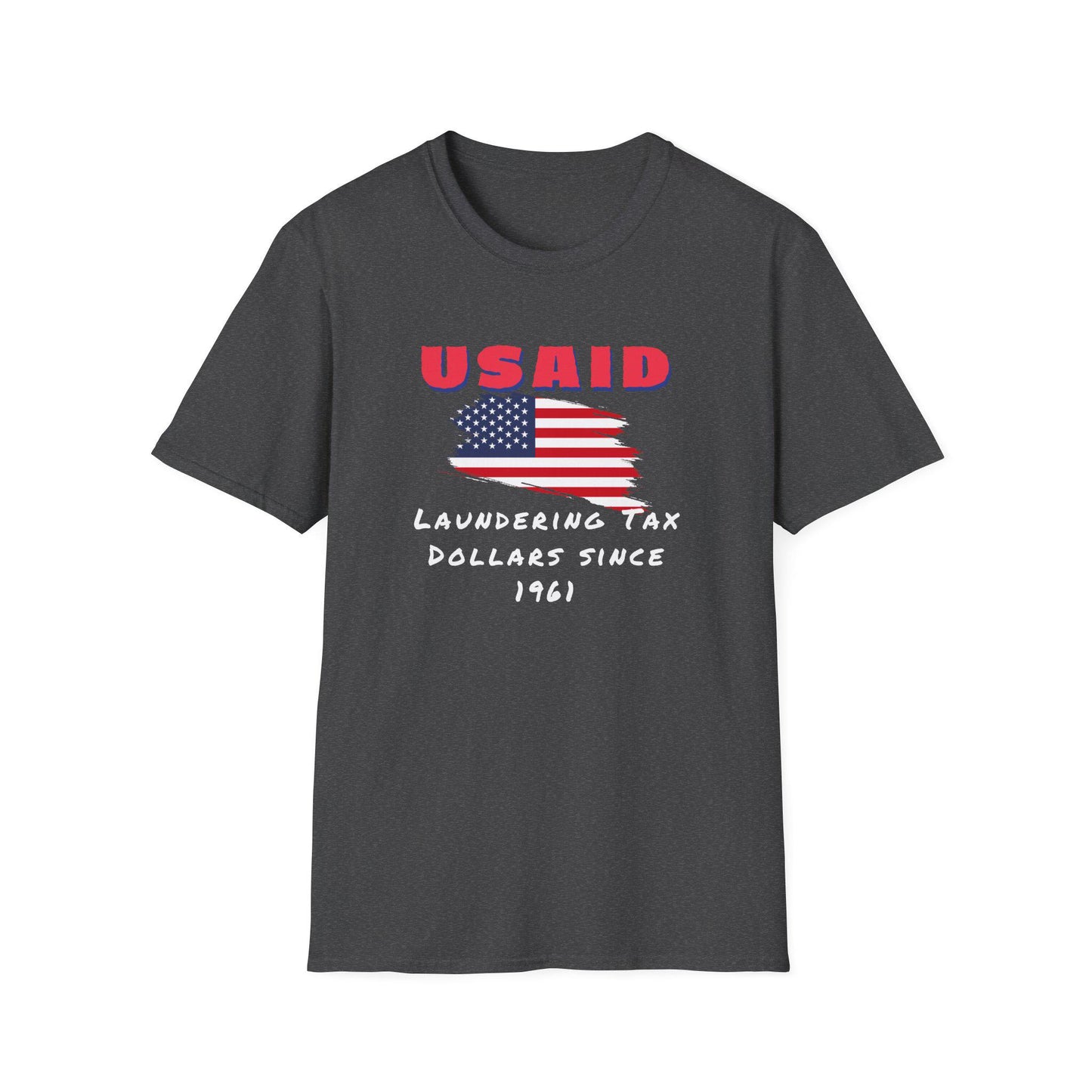 A dark heather gray T-shirt is displayed flat against a white background. The shirt features a bold graphic design with a distressed American flag in the center. Above the flag, red text reads &quot;USAID&quot; in all caps. Below, white handwritten-style text states: &quot;Laundering Tax Dollars Since 1961.&quot; The design has a satirical political tone with a rugged, protest-inspired aesthetic.