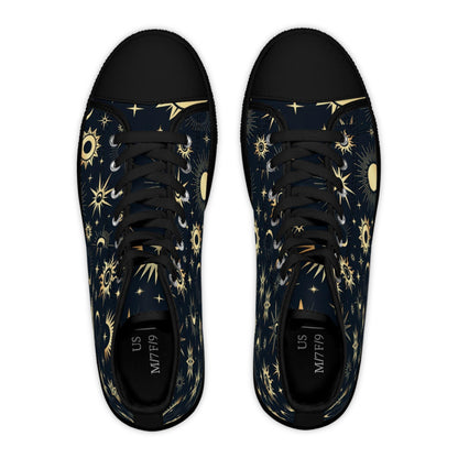 Top-down view of a pair of high-top sneakers with a celestial design featuring golden suns, moons, and stars on a dark navy background. The shoes have black laces, black rubber toe caps, and black insoles labeled “US M7/F9.” The design is symmetrical and bold, blending cosmic elegance with a modern, edgy style.