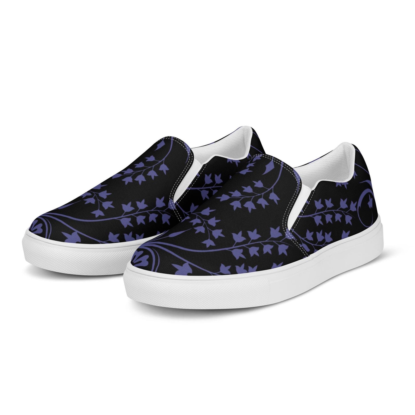 Pair of slip-on sneakers with a black canvas upper featuring a deep purple ivy vine pattern. The shoes have white soles, elastic side accents for easy wear, and a clean, minimal design ideal for casual and stylish everyday outfits.