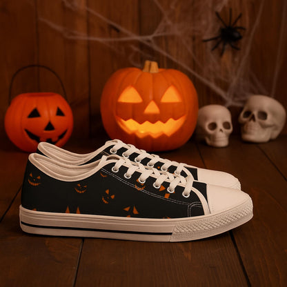 Halloween jack-o&#39;-lantern low-top canvas sneakers for women, black and white lace-up shoes with spooky pumpkin face pattern, perfect Halloween footwear for fall parties and trick-or-treat style – displayed with carved pumpkins, skulls, spider and cobwebs on rustic wood background.