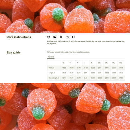 Care instructions and size guide displayed over a background of sugary pumpkin-shaped Halloween candies. Care instructions include symbols and text: machine wash cold (max 30°C or 90°F), do not bleach, tumble dry low heat, iron/steam/dry low heat, and do not dry clean. The size chart (imperial) provides measurements in inches for sizes XS to 5XL, listing width, length, and sleeve length.