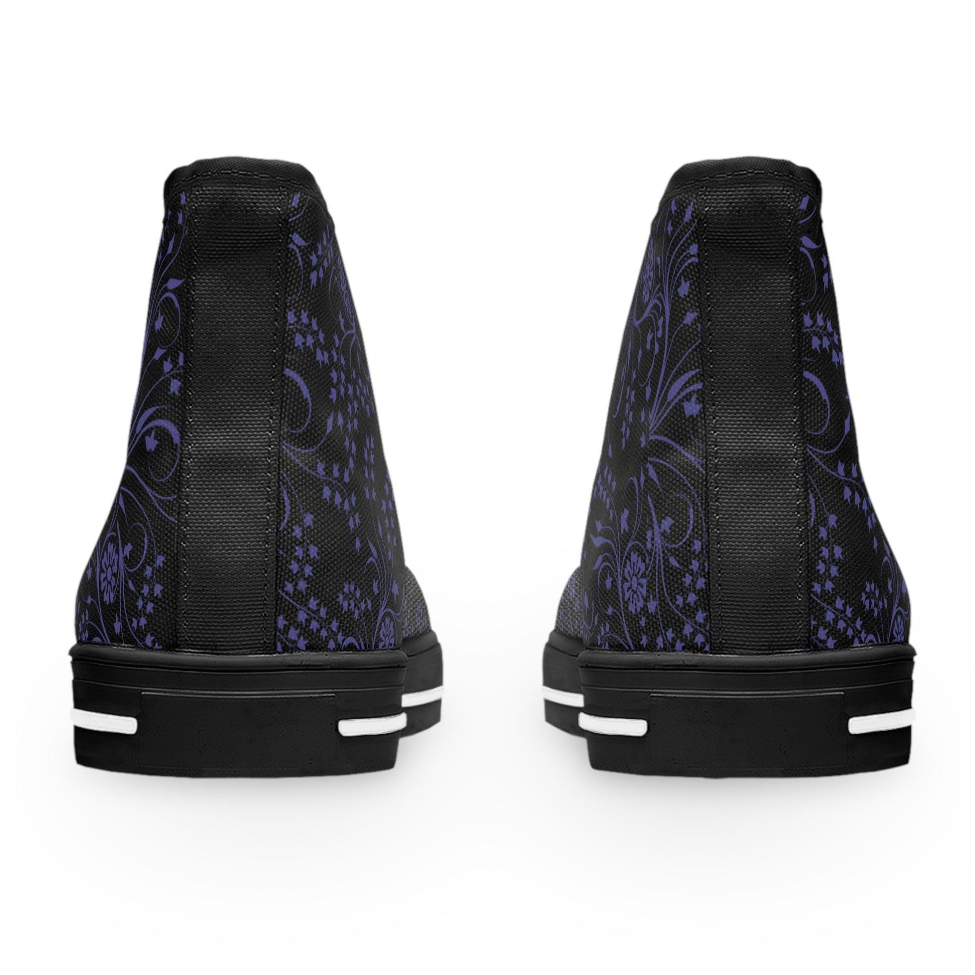 Rear view of a pair of high-top sneakers shown against a white background. The shoes feature a black upper with an intricate purple floral and paisley pattern. A solid black vertical strip runs down the back of each shoe, complementing the black soles with white accent lines for a sleek, stylish contrast.