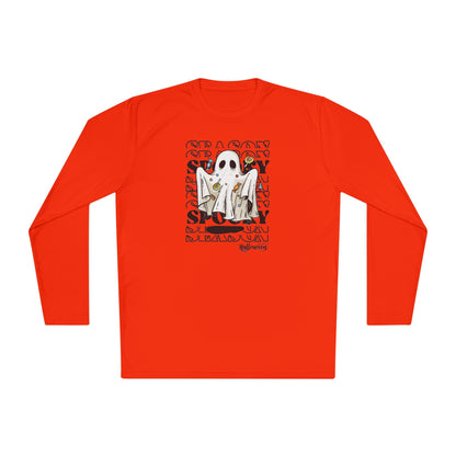 Bright orange long-sleeve shirt featuring a Halloween-themed graphic of a ghost costume holding candy, centered on the chest. The background of the design includes a repeating pattern of the words &#39;SEASON&#39; and &#39;SPOOKY&#39; in bold, stylized text, with &#39;Halloween&#39; written at the bottom.
