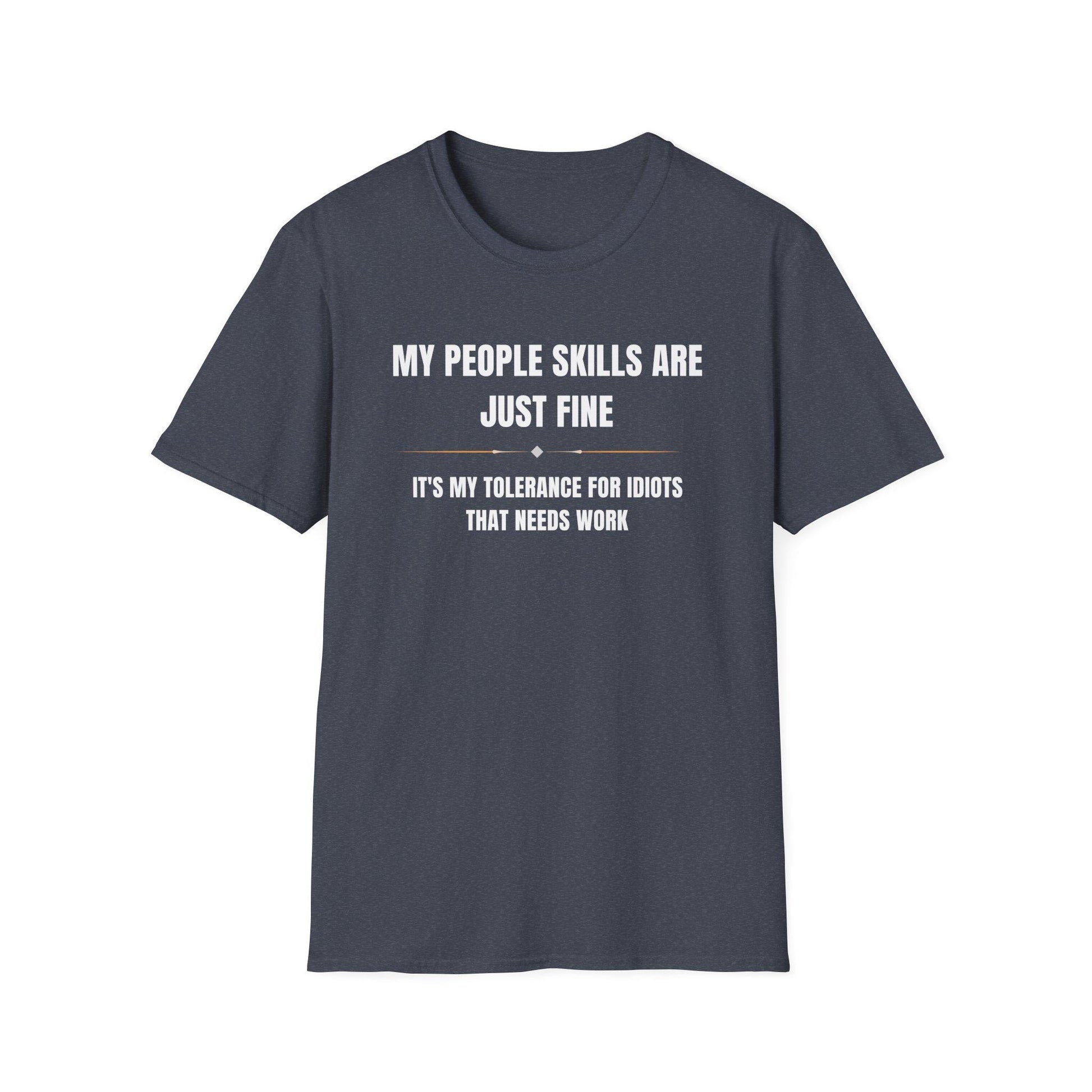 Dark heather navy unisex T-shirt displayed flat on a white background, featuring bold white and gold text that reads: “MY PEOPLE SKILLS ARE JUST FINE — IT’S MY TOLERANCE FOR IDIOTS THAT NEEDS WORK.” A small decorative line with diamond accents separates the two text sections.