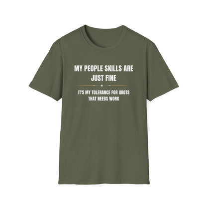 Military green unisex T-shirt laid flat on a white background, featuring bold white and gold typography that reads: “MY PEOPLE SKILLS ARE JUST FINE — IT’S MY TOLERANCE FOR IDIOTS THAT NEEDS WORK,” with a thin gold line and diamond accents separating the phrases.