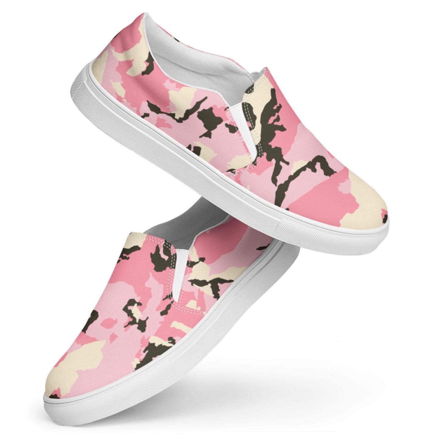 Pair of pink camouflage slip-on sneakers with cream and black accents, shown in a stacked display against a white background, highlighting the shoes&#39; side profile and sleek white rubber soles.