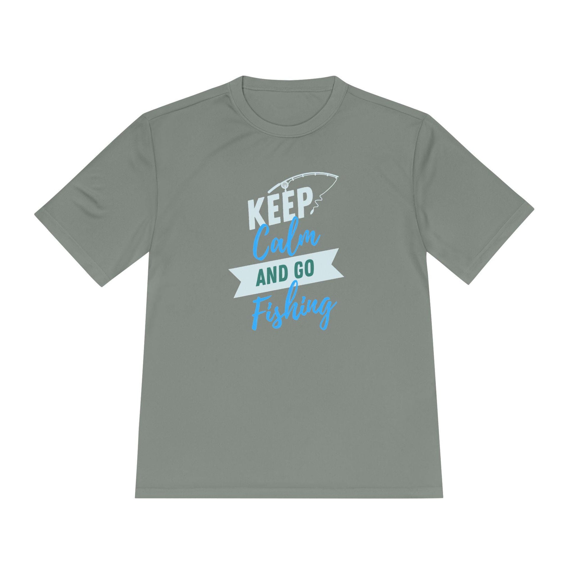Flat lay of a sage green T-shirt with a playful fishing-themed design. The graphic features the text “KEEP Calm AND GO Fishing” in a mix of white, teal, and blue fonts, accompanied by a fishing rod illustration above the word “KEEP.” Displayed on a clean white background, the shirt has a relaxed, unisex fit ideal for outdoor or casual wear.