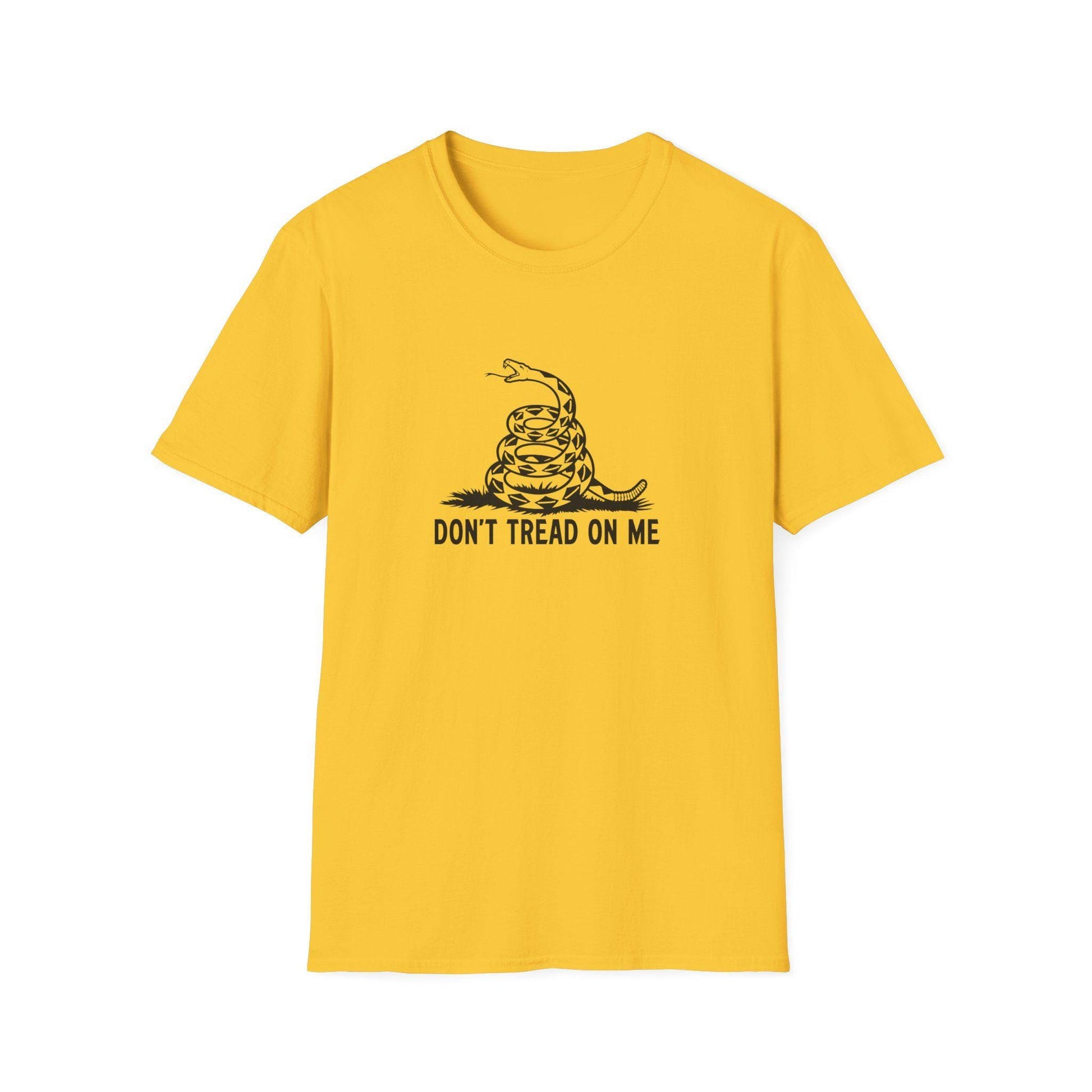 Flat lay of a yellow unisex t-shirt featuring a bold black graphic of a coiled rattlesnake above the text “DON’T TREAD ON ME.” The design is centered on the chest, inspired by the historic Gadsden flag, symbolizing liberty and resistance to oppression. The shirt is displayed on a white background.