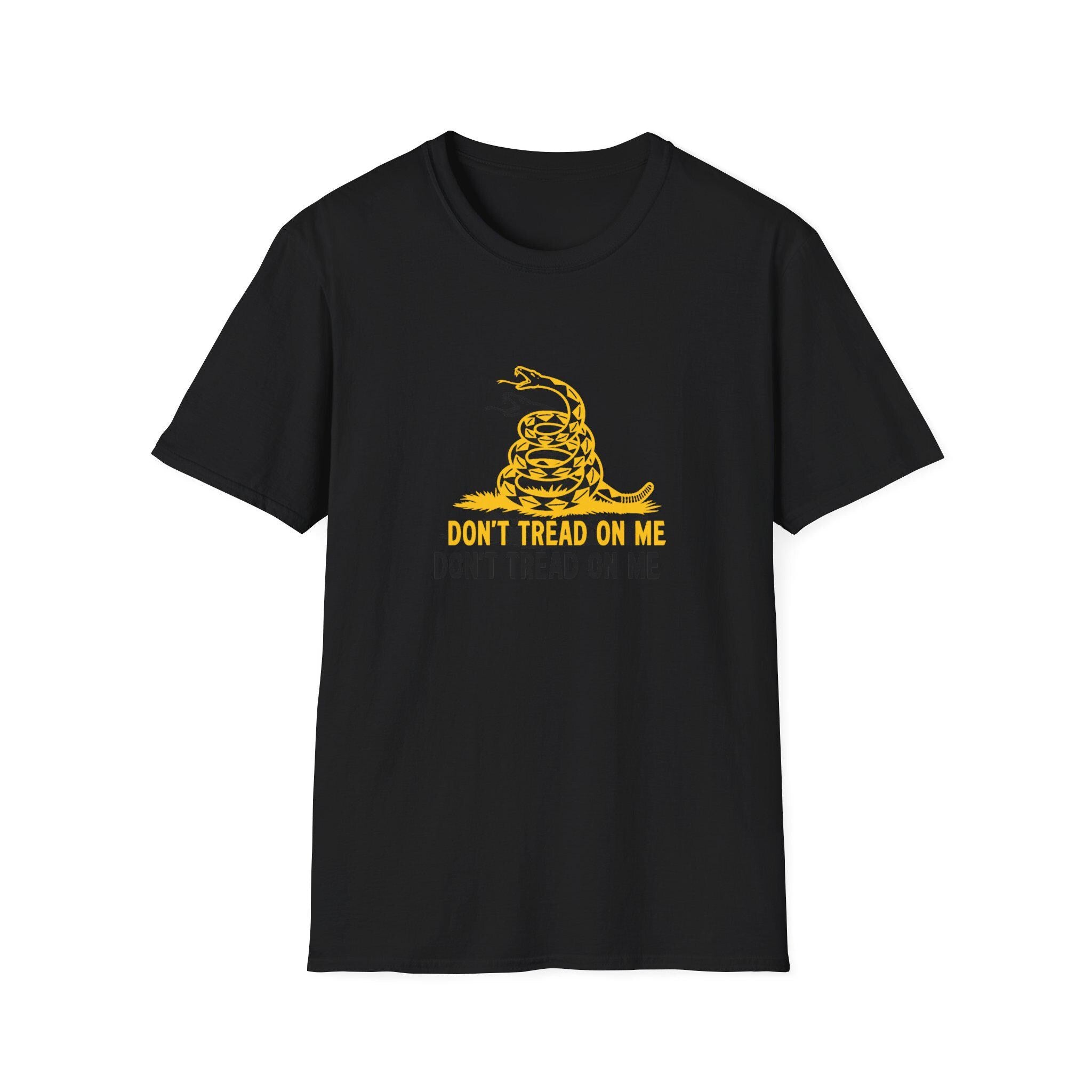 Flat lay of a black unisex t-shirt featuring a bold yellow graphic of a coiled rattlesnake above the text “DON’T TREAD ON ME.” The design is inspired by the Gadsden flag, symbolizing independence and personal liberty. The shirt is laid flat on a white background.